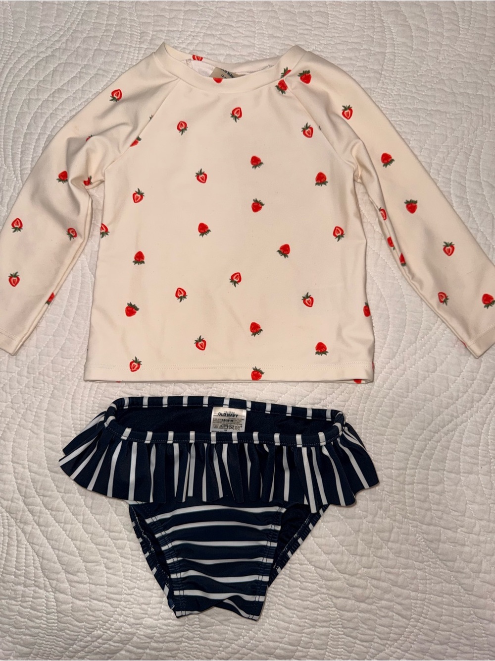 Cream Strawberry Rash Guard Top & Navy Striped Ruffle Bikini Bottoms